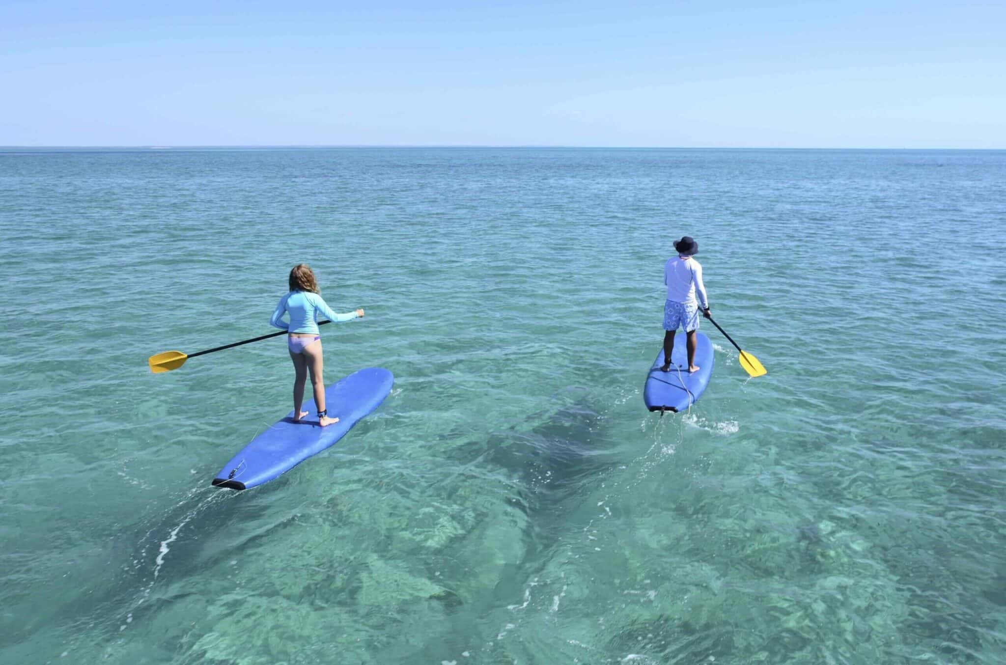 stand up paddle boarding in the ocean