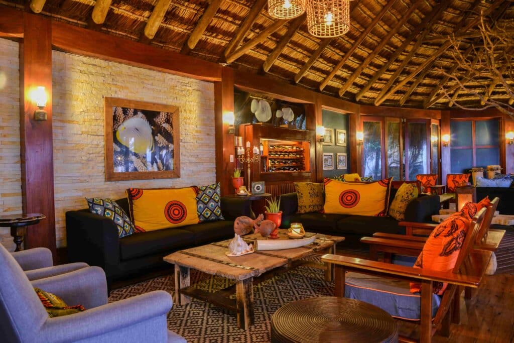 Lounge interior with couches and chairs around the tables at Machangulo Beach Lodge