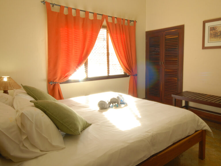 Double bed inside the Castelo Do Mar Hotel room in Mozambique