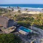 Private pool and lodge accommodation on a hill at Travessia Beach Lodge overlooking the ocean