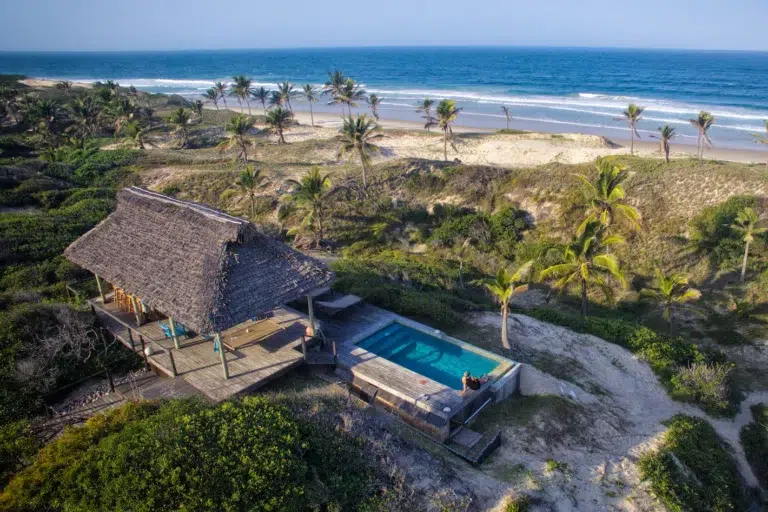 Private pool and lodge accommodation on a hill at Travessia Beach Lodge overlooking the ocean