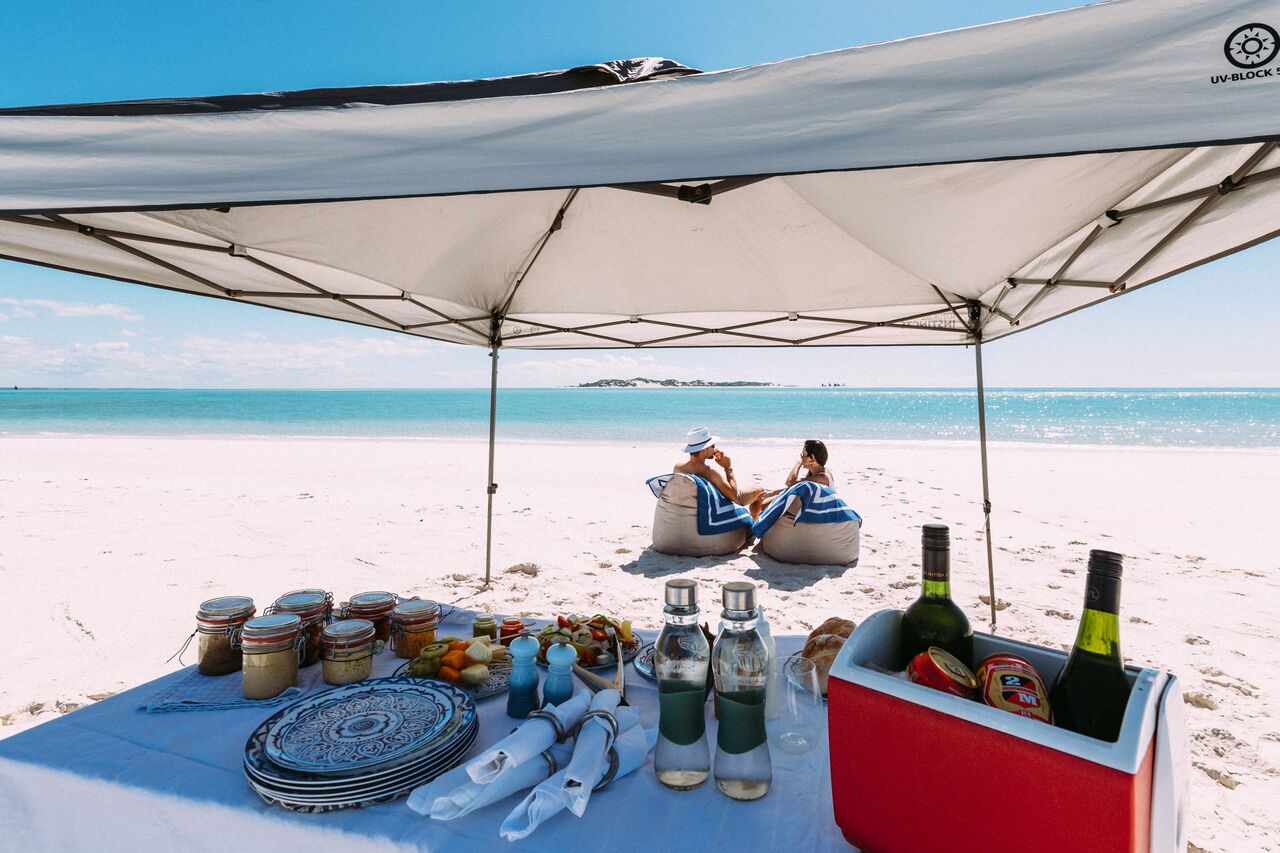 couple having picnic on the beach in Mozambique