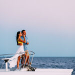 Couple watching the sunset on a boat in Mozambique