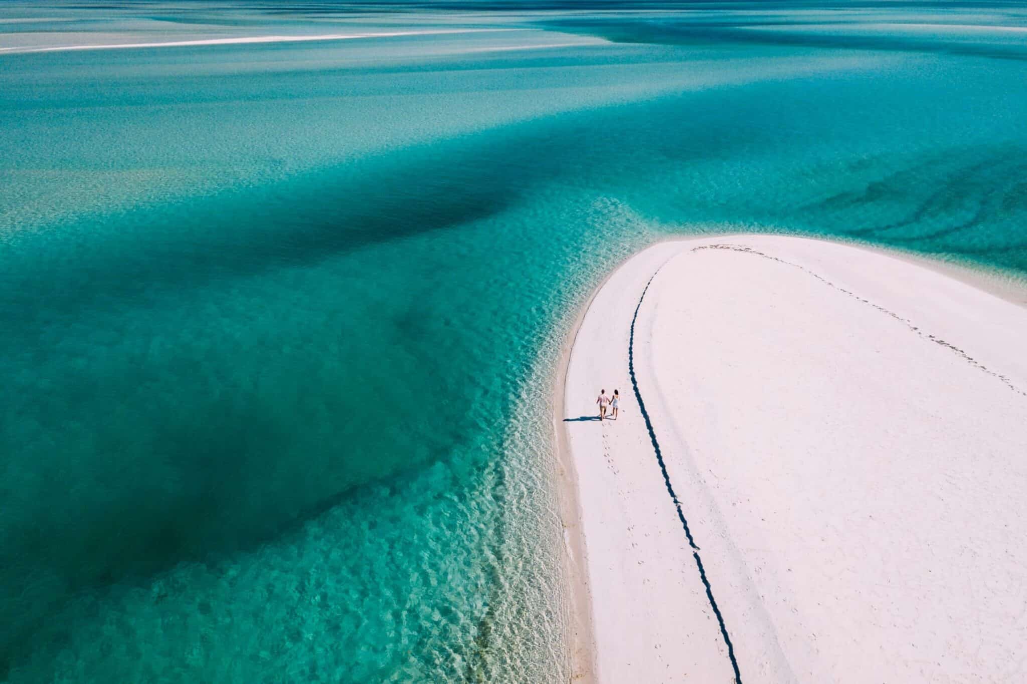 Aerial view of a couple walking on the beach in Mozambique