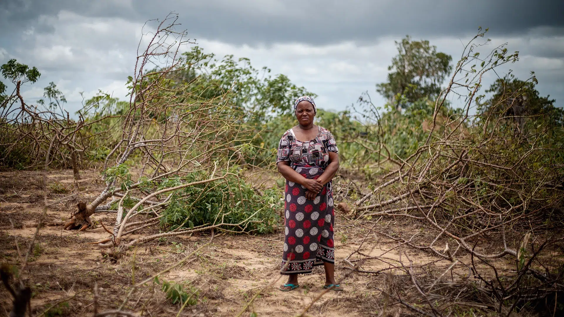 Maria Nguila standing infront of her destroyed crops from Cyclone Freddy