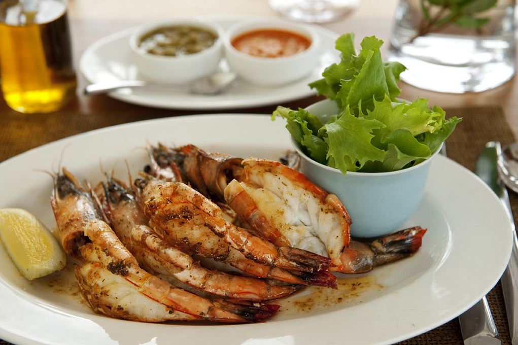 A dish of fresh prawns served with salad at White Pearl Resorts in Mozambique