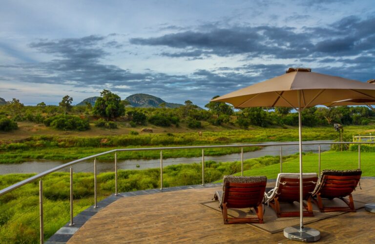 Relaxing outdoor deck with lagoon views in Bilene